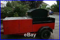 Mobile wood fired pizza oven trailer with BBQ pit/charcoal grill and hogroast